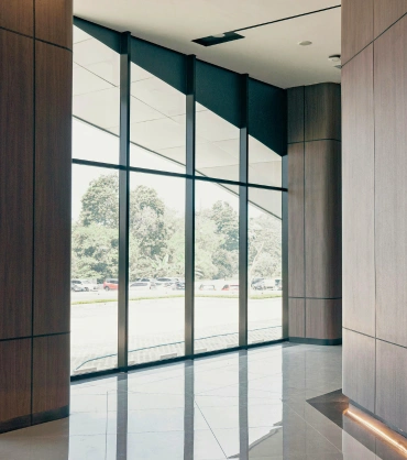 best aluminium windows UAE interior with full height glass panels and modern architectural design