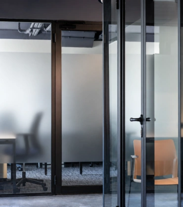 Glass Partitions in Dubai featuring frosted glass and aluminium framing for office privacy