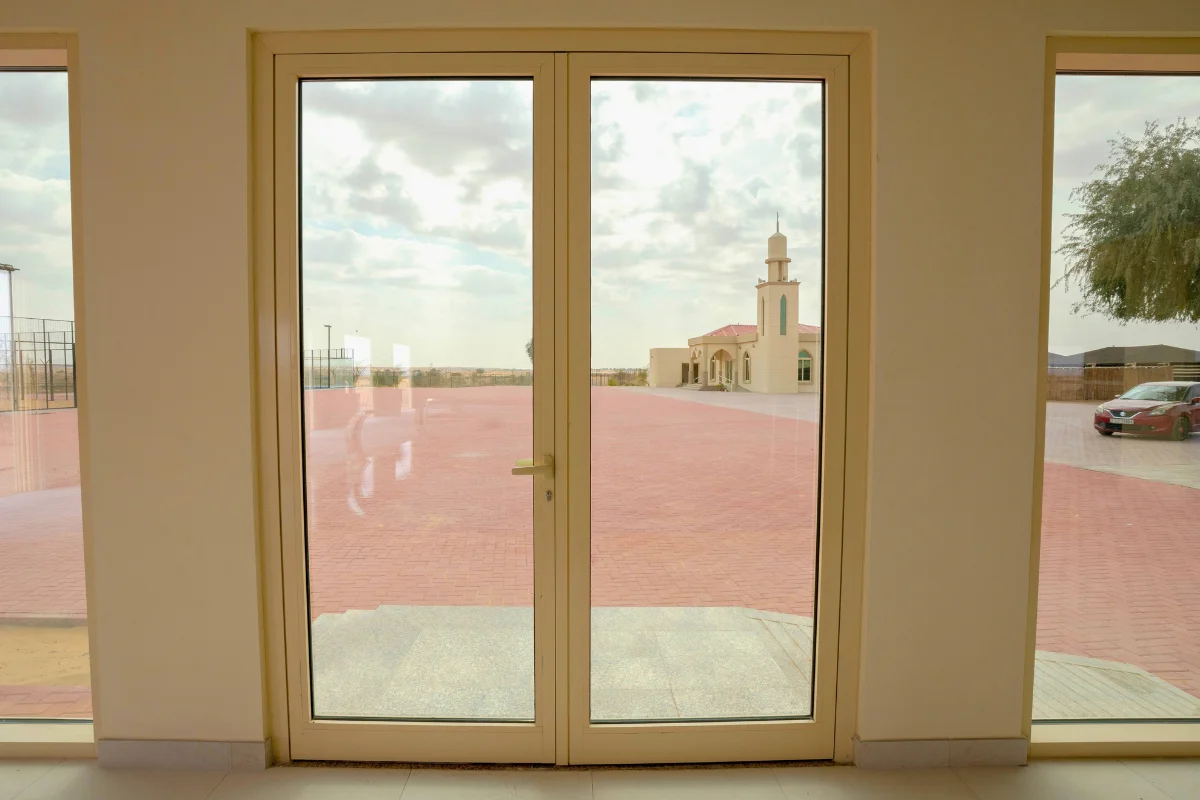 Aluminium-framed glass double door at a residential entrance